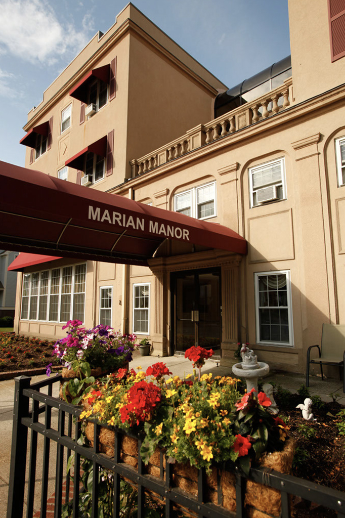 Marian Manor entrance with red awning