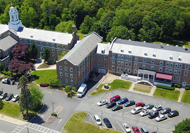 Aerial view of campus buildings and parking